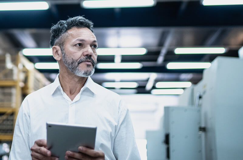 Business professional reviewing regulatory compliance information on computer