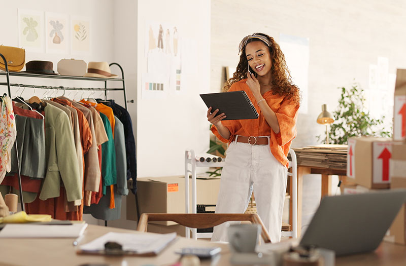 Woman working in store with tech
