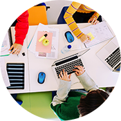 Children working using the Chrombook laptops 