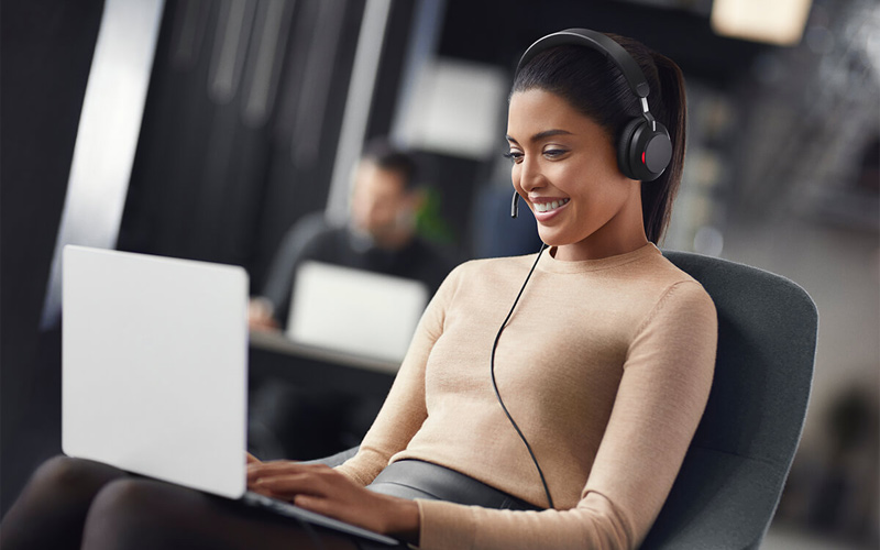 Woman in meeting using Jabra Evolve