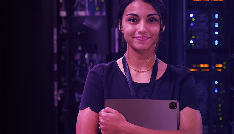 woman holding laptop smiling