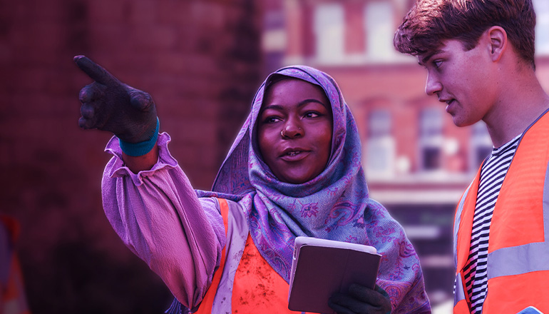 Colleagues in hi-vis talking