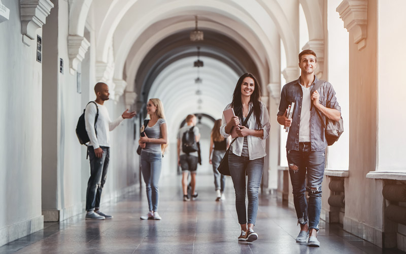 Students walking together through campus