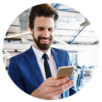 Businessman checking smart phone for virtual communications