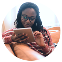 Woman using tablet computer to access eCommerce site from home