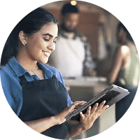 Woman smiling using her tablet