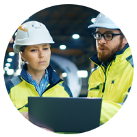 Two manufacturers in factory work on device