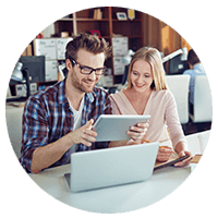 Two employees on tablet device