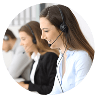 Woman on headset works on desktop computer