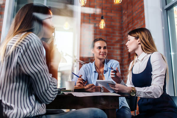 Businesswomen collaborate in modern office