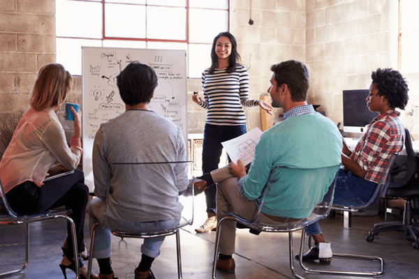 Team of business professionals gather to brainstorm ideas