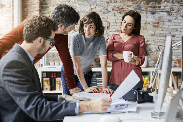 Team having a collaborative brainstorm session in modern office
