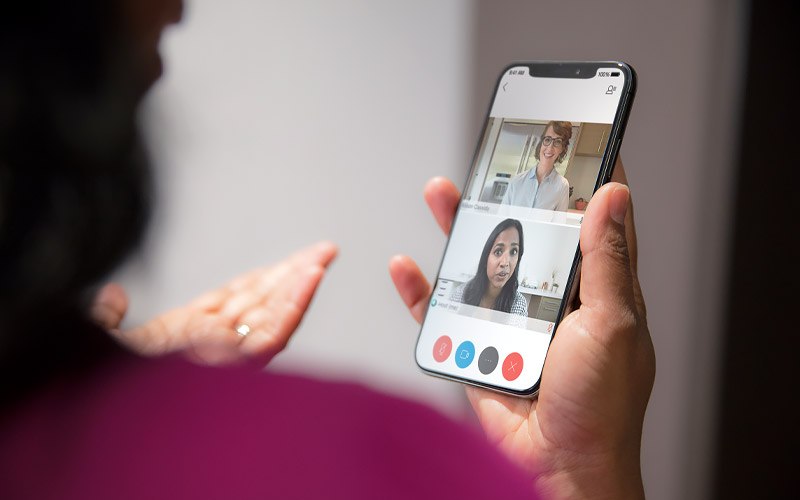 Businesswoman using Cisco Webex on mobile device