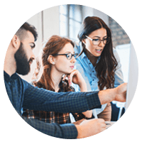 Group of IT professionals gathered around computer