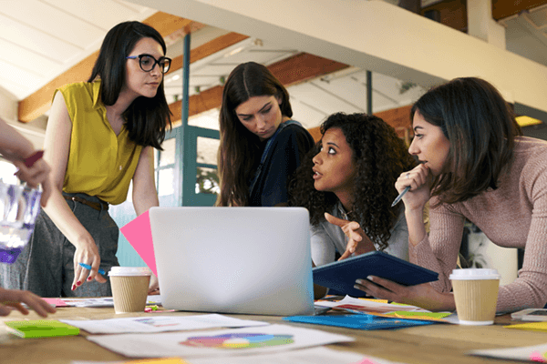 Group of teammates discuss creative strategy