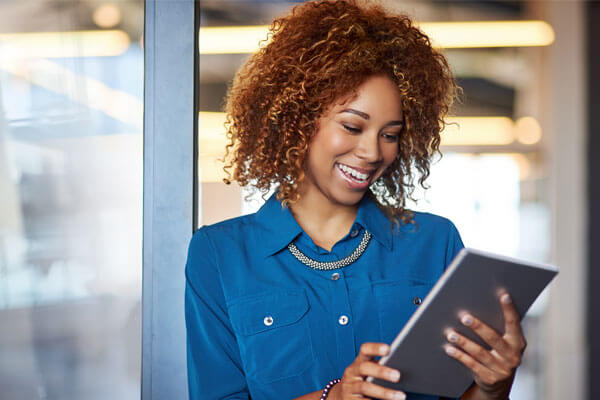 Business woman using client application with ease in office