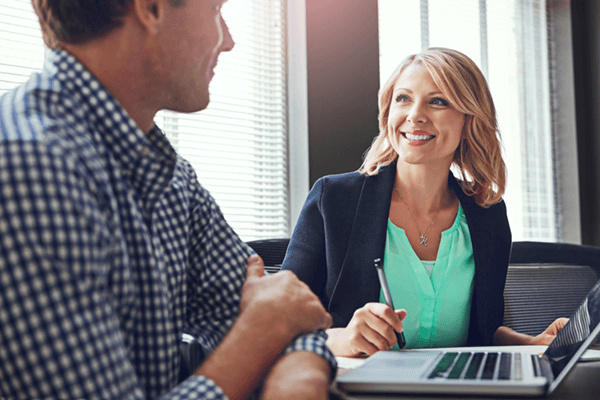 Businesswoman ready to get contract signed in front of laptop computer