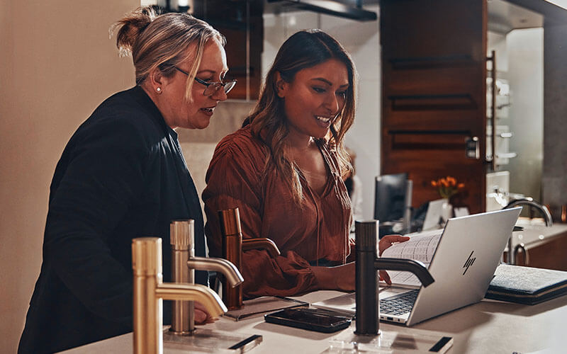 Accelerate your potential Two woman using Lenovo laptop