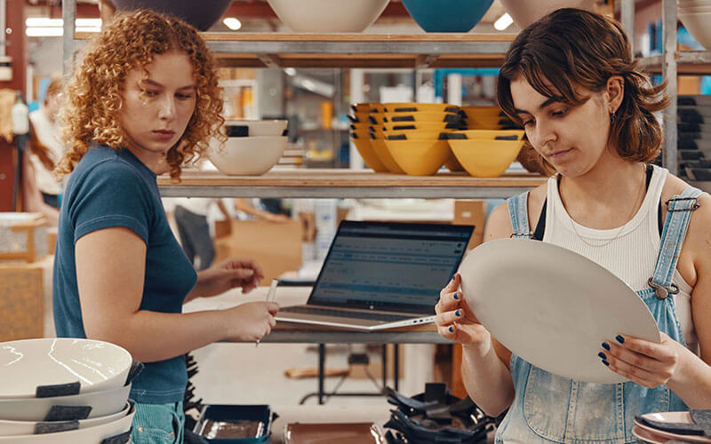 Enhanced productivity Two woman working together