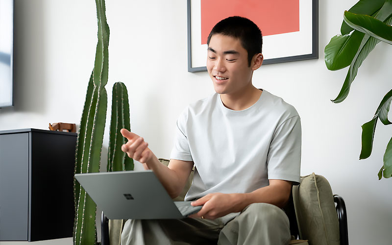Smiling professional using a Microsoft Surface device