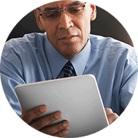 A professional on a tablet working on a solution