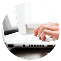Close up of hands typing on a keyboard