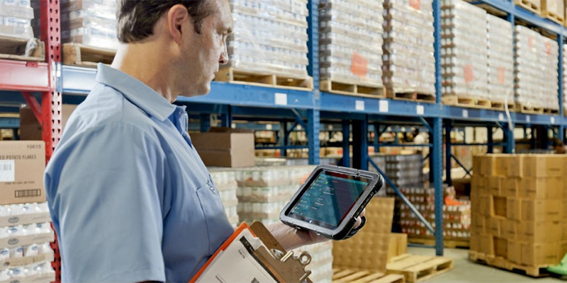 Distribution manager checking inventory on Zebra mobile computer
