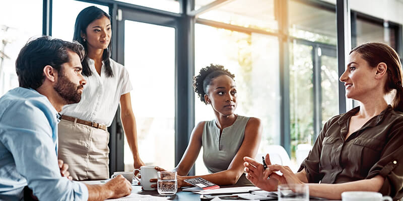 Business team has discussion in modern office