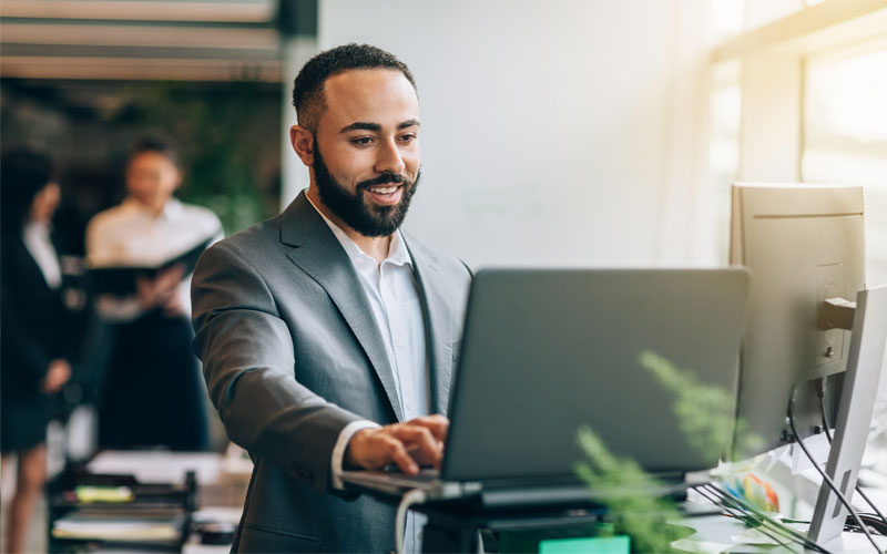 Guy smiling at computer