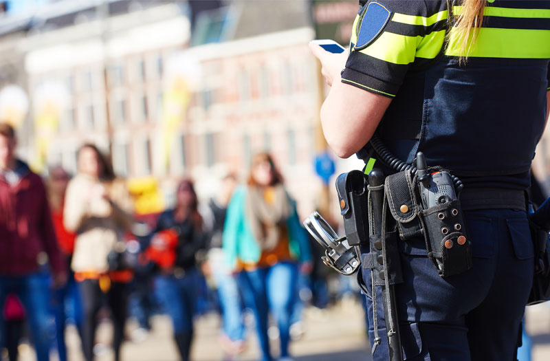 Police officer monitors crowd