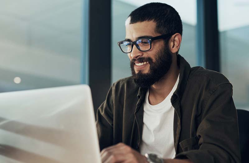 Advance potential Man with glasses using his laptop