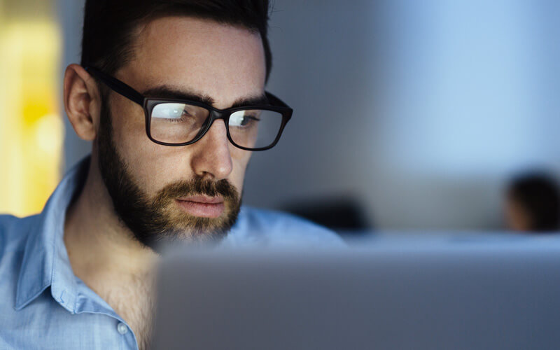 Man using tablet device in office.