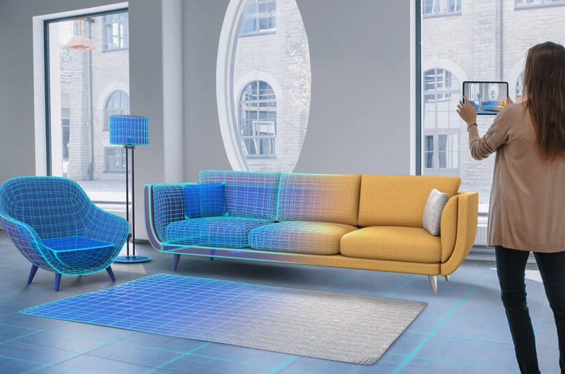 Interior designer using modern VR application to stage room