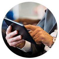 Business man's hands touching tablet device