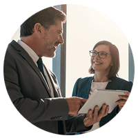 Executive on tablet computer with client