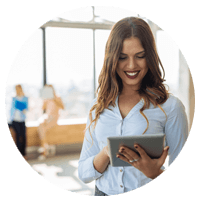 Smiling business woman working off of mobile device