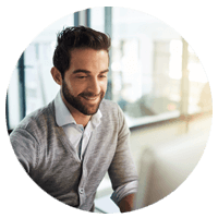 Man smiling at monitor