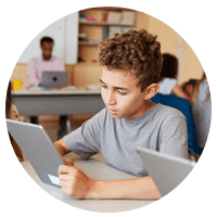 Students using tablet devices in classroom