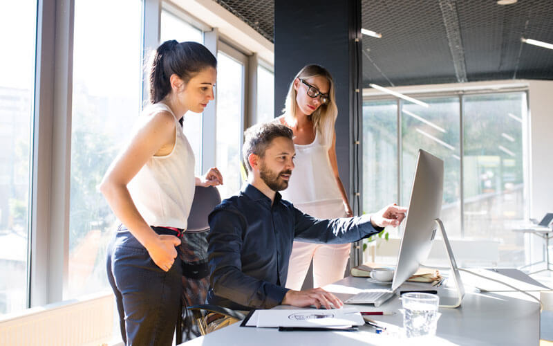 Three coworkers collaborating