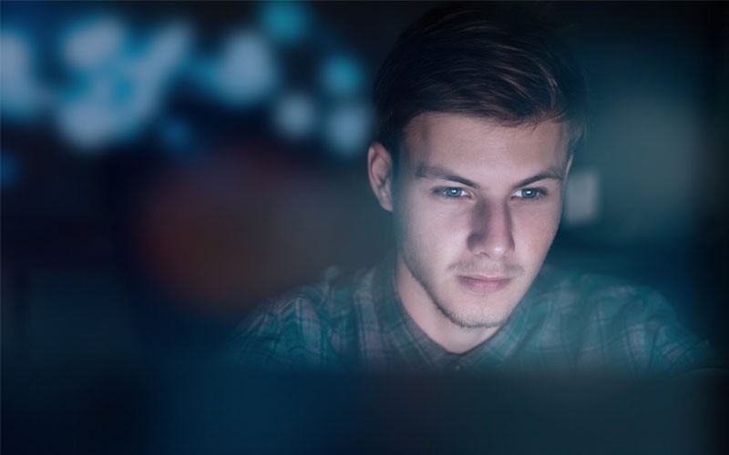Symantec Content Analysis Man looking over desktop
