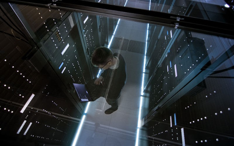 Backup Exec software Man working in server room