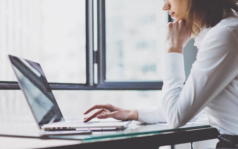 Desktop and laptop data protection Woman typing on laptop