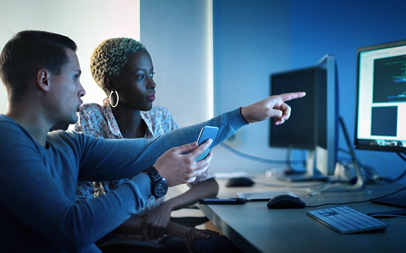 Adopting new technology gives you a lean, reduced footprint IT professionals working on desktop computer