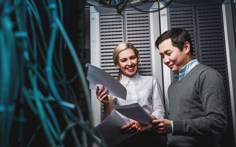A tailored cloud and data center strategy Two IT technicians review data center strategy