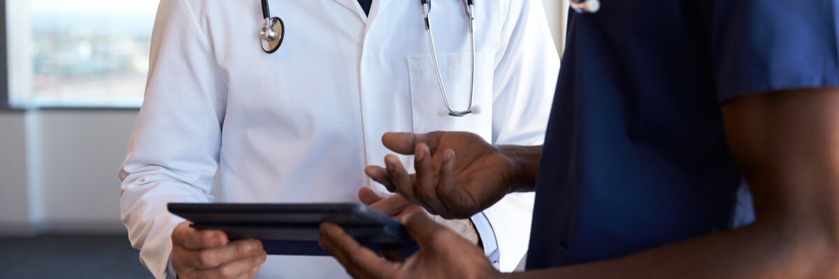 Healthcare professionals using tablet