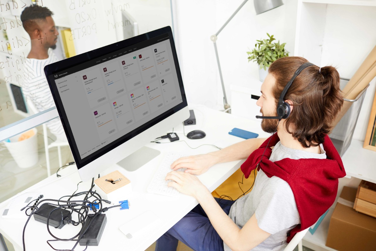Find a plan to fit your needs. man using adobe tools