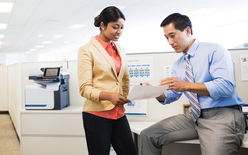 MPS blends HP’s innovative hardware, software and services Business professionals have a discussion near a HP LaserJet Enterprise color flow MFP M575c