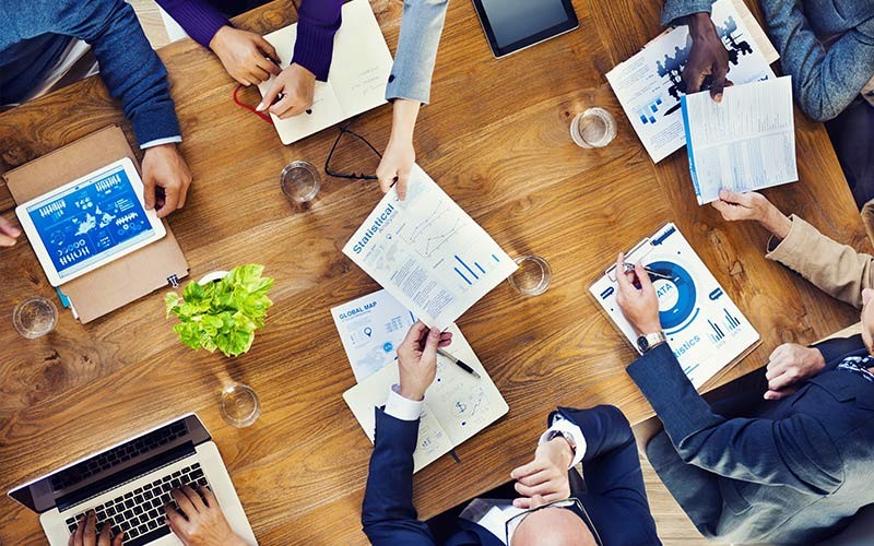Group of employees around a table