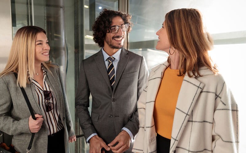 Three employees discussing