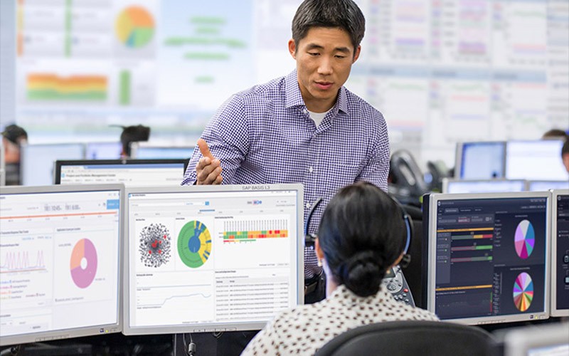 Two colleagues working in an open office